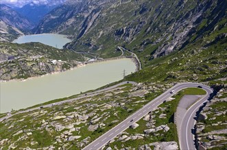 Serpentine of the Grimselpass road in front of the reservoirs Grimselsee