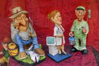 Shop window with funny ceramic figures of different professions