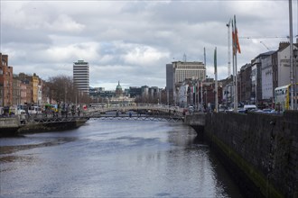 A view of the Ha'penny bridge and Dublin city skyline with Liberty Hall to the left on a nice march day. Dublin