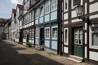 Narrow alley with historic half-timbered houses in the old town