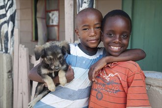 Two smiling happy African children in township near Swakopmund
