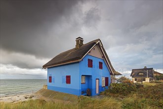 Blue beach house on the peninsula Graswarder