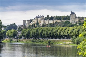 Kayaks on the river Vienne in front of Chinon with the castle