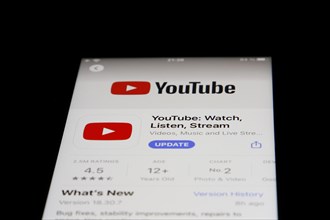 Detailed view of a smartphone with Youtube app in the iPhone App Store