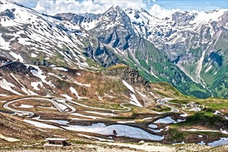 Photo with reduced dynamic saturation HDR of mountain pass alpine mountain road alpine road pass road pass old Grossglockner High Alpine Road Grossglockner High Alpine Road with serpentine switchbacks...
