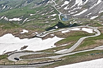 Photo with reduced dynamics saturation HDR of mountain pass alpine mountain road alpine road pass road pass old Grossglockner High Alpine Road Grossglockner High Alpine Road with serpentines with cobb...