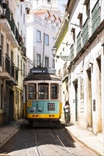 Tram in an alley in the old town of Lisbon