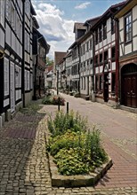 Narrow alley with historic half-timbered houses in the old town