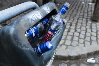 Several vodka bottles in a rubbish bin in Duesseldorf