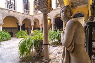Statue in the courtyard of the Palacio de la Condesa de Lebrija Palace and Museum in Seville
