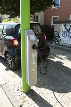 A car loads at a lamppost in Dortmund