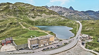 Photo with reduced dynamics saturation HDR of mountain lake at mountain pass alpine mountain road alpine road pass road Bernina Pass Bernina Pass