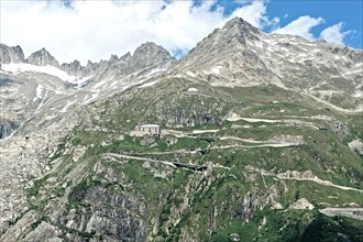 Photo with reduced dynamics saturation HDR of mountain pass alpine mountain road alpine road pass road pass Furkapass with serpentines
