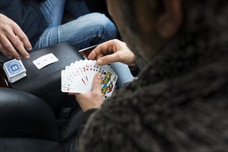 Two people playing cards in a car