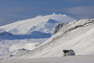 Lonely house in desolate landscape in the snow in winter on the Snaefellsnes peninsula in Iceland