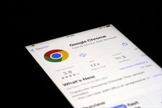 Detailed view of a smartphone with Google Chrome App in the iPhone App Store