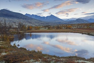 Tundra landscape with lake in autumn