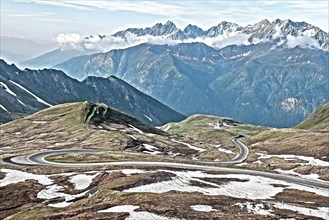 Photo with reduced dynamics saturation HDR of mountain pass alpine mountain road alpine road pass road pass Grossglockner-Hochalpenstrasse Grossglockner High Alpine Road on alpine plateau above tree l...