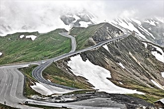 Photo with reduced dynamic saturation HDR of mountain pass alpine mountain road alpine road pass road pass old Grossglockner High Alpine Road Grossglockner High Alpine Road without cars no traffic abo...
