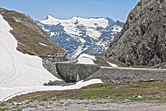 Photo with reduced dynamic saturation HDR of bridge stone bridge mountain pass alpine mountain road alpine road pass road pass Col de l'Iseran