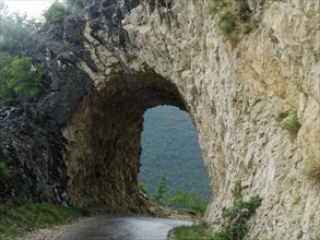 Passage through the rocks on the high road over the Durmitor massif. The Durmitor National Park surrounding the massif is a UNESCO World Heritage Site. Pluzine