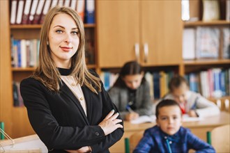 Female teacher blurred background classroom