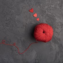 Red wool ball slate background