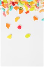Scattered candies white table