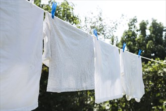 White laundry hanging string outdoors