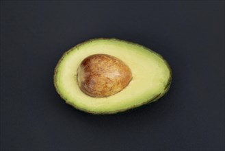 Top view avocado half with pit