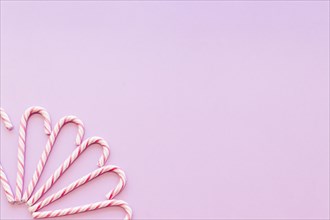 Design made with xmas candy cane pink background corner