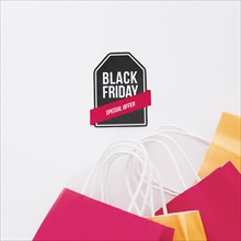 Black friday composition with label shopping bags
