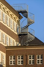 Detail of a brick building with spiral staircase