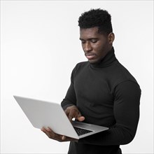 Focused man using laptop