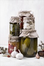 Jars arrangement with picked vegetables