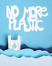 Top view paper ocean waves with plastic bag message