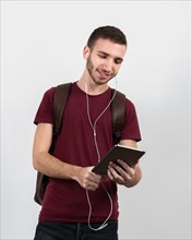 Guy listening music tablet