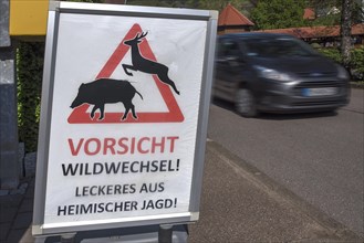 Poster Caution deer crossing on Dorfstr. in front of a restaurant