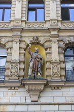 Sculpture on the facade of a building in Marktstrasse