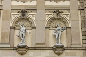 A male and female statue on the facade of the Hessian State Theatre Wiesbaden