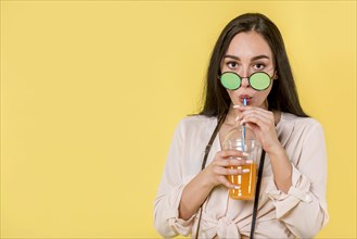Woman green sunglasses with juice