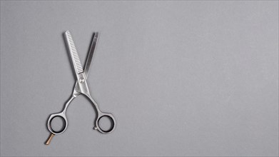 High angle view scissors grey background