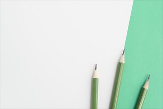 Green sharp pencils dual background