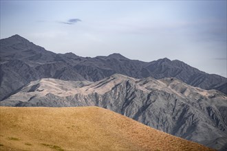 View over eroded mountainous landscape with brown hills