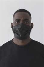 Front view black person wearing mask