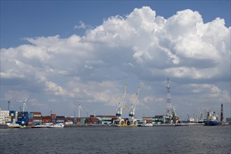 Harbour cranes and container ships in the port of Antwerp