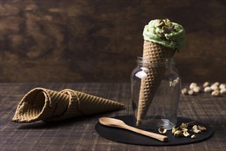 Delicious ice cream cones with pistachio