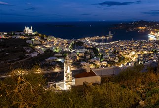 View of the illuminated town of Ermoupoli with Anastasi Church or Church of the Resurrection