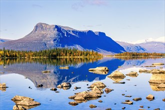 Mirrored lake in a beautiful mountainous landscape in beautiful autumn colours