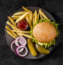 Top view burger fries plate with pickles